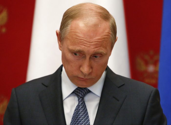 Russian President Vladimir Putin takes part in a news conference after meeting with Swiss Federal President Didier Burkhalter in the Kremlin in Moscow, Wednesday, May 7, 2014. (AP Photo/Sergei Karpukhin, Pool)